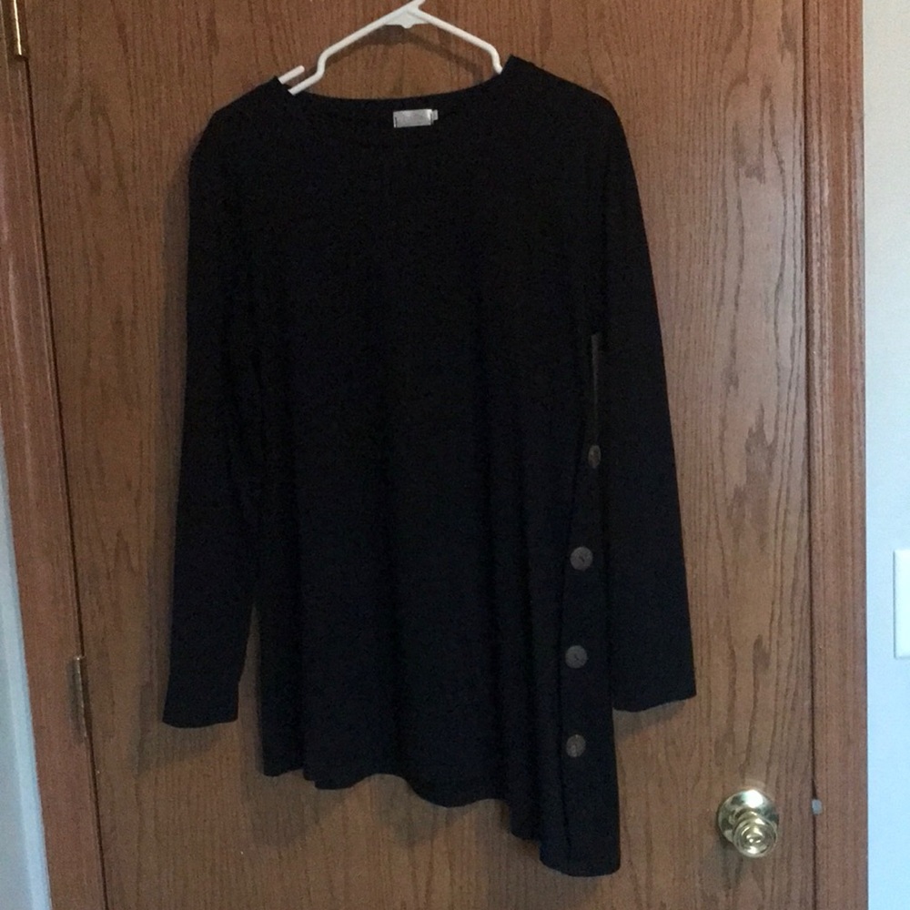 Black top perfect with skinny jeans and boots.